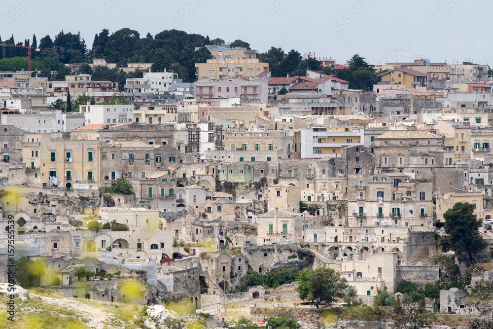 Matera, Italy - May 20, 2017: Panoramic view of the city from the belvedere square with background the clouds in the sky