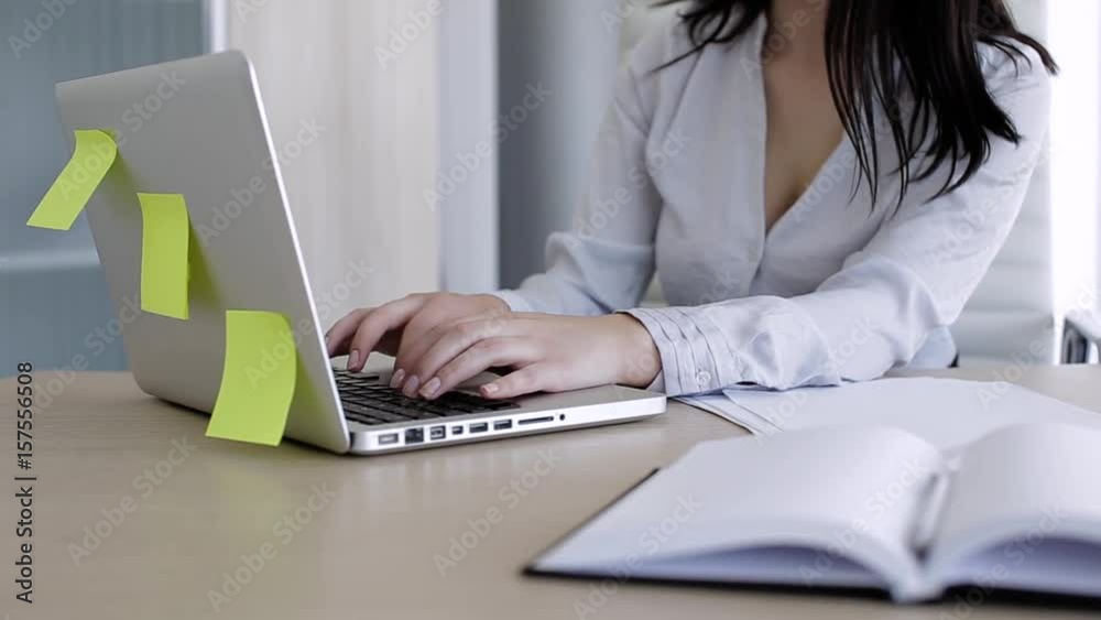 Hands of woman in office typing on laptop Hands of woman in office typing on laptop