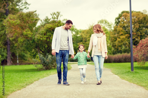 happy family walking in summer park