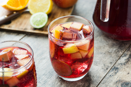 Sangria drink in glass on wooden table 