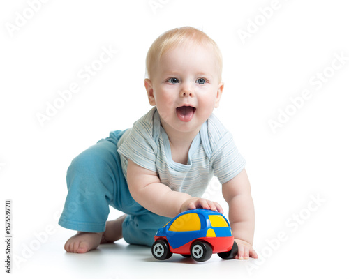 Baby boy playing with car t...