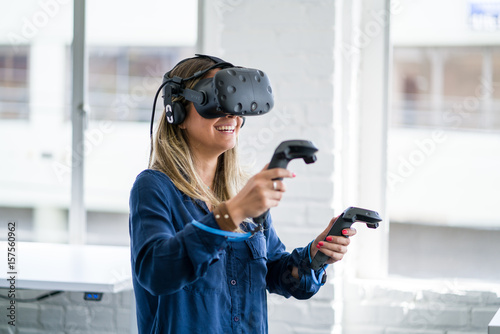Young woman wearing a virtual reality headset. © db