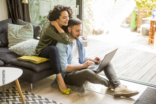 Young couple with tablet in...