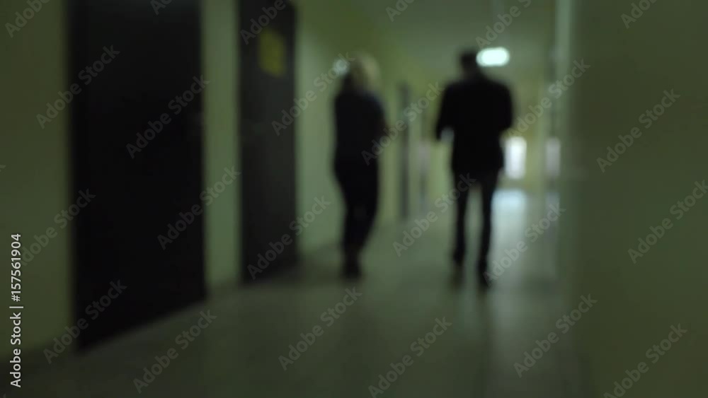 Silhouettes of people pass through the dark corridor. Incognito .Espionage. Silhouettes of people pass through the dark corridor. Incognito .Espionage.