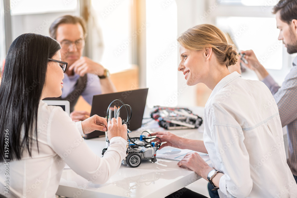 Joyful colleagues working together in office Joyful colleagues working together in office