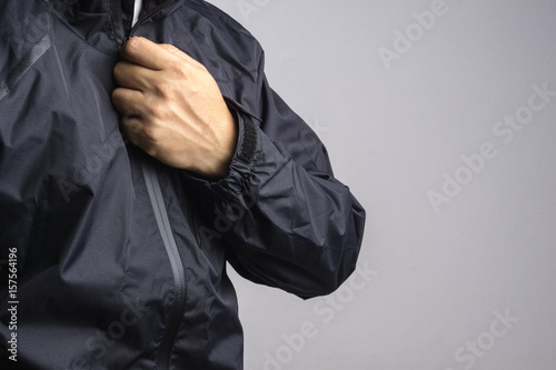 Foto Man wearing black anti static or wet weather jacket or rain coat
