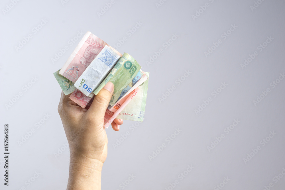 Hand holding Thai money or banknotes Hand holding Thai money or banknotes