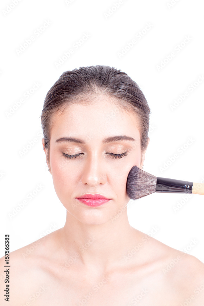 Makeup artist applies brushed at woman face. Beautiful woman face. Perfect makeup, isolated on white background, 20s year old. Makeup artist applies brushed at woman face. Beautiful woman face. Perfect makeup, isolated on white background, 20s year old.