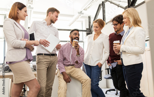 happy business team drinking coffee at office