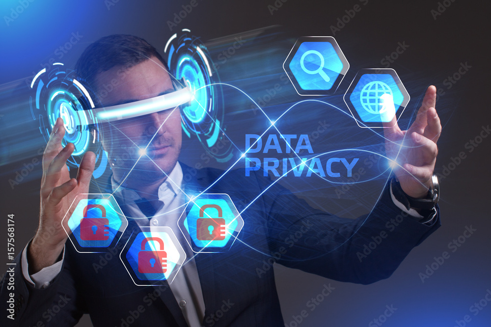 Fototapeta premium Business, Technology, Internet and network concept. Young businessman working in virtual reality glasses sees the inscription: Data privacy