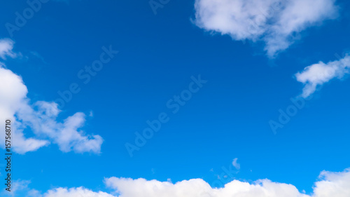 Fluffy White Clouds in Blue Sky