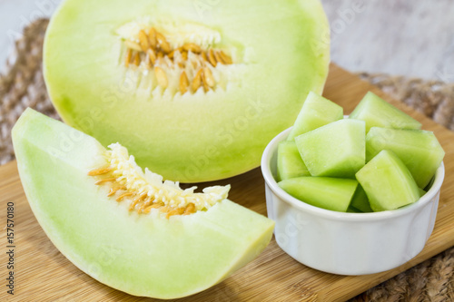 Honeydew Melon On Wooden Cutting Board For Breakfast Food