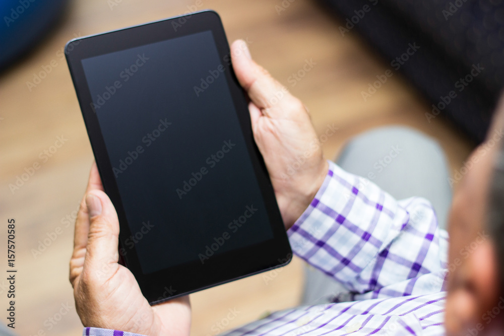 Senior using modern digital tablet
