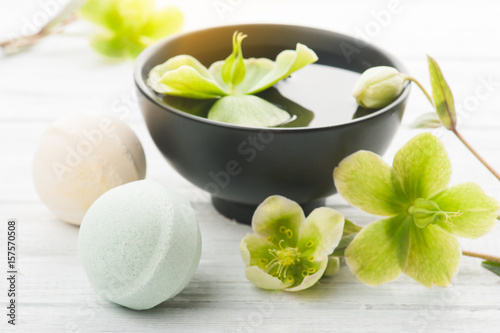 Bath bombs on white wooden background