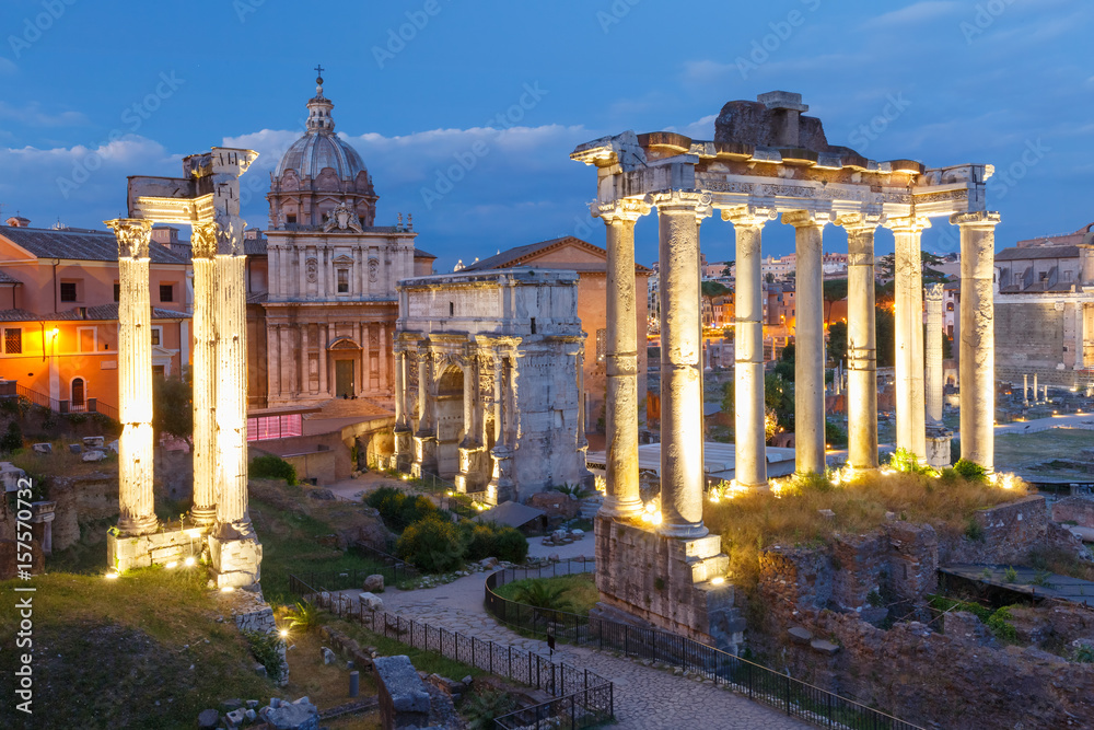 Ancient ruins of a Roman Forum or Foro Romano during evening blue hour in Rome, Italy. View from Capitoline Hill