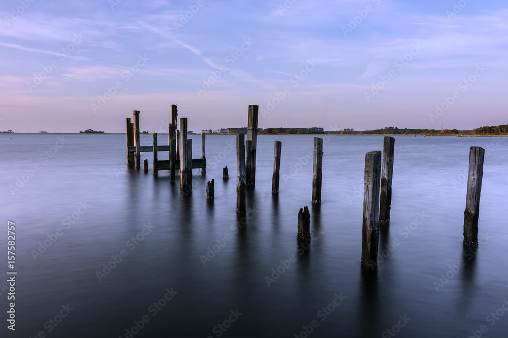 Long Exposure of Old Dock Pilings at Sunrise Long Exposure of Old Dock Pilings at Sunrise