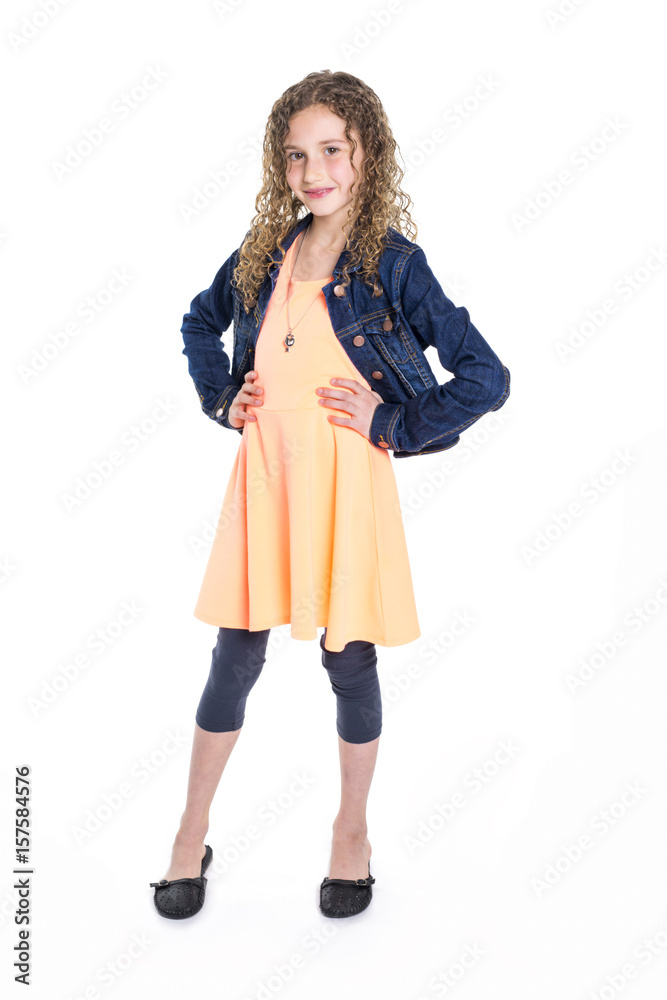 Portrait of happy, smiling, confident 9 years old girl with curly hair, isolated on white Portrait of happy, smiling, confident 9 years old girl with curly hair, isolated on white