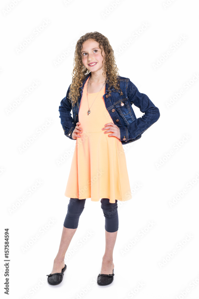 Portrait of happy, smiling, confident 9 years old girl with curly hair, isolated on white Portrait of happy, smiling, confident 9 years old girl with curly hair, isolated on white