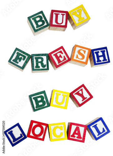 BUY FRESH BUY LOCAL concept spelled with colorful toy alphabet blocks. Isolated. © Noel