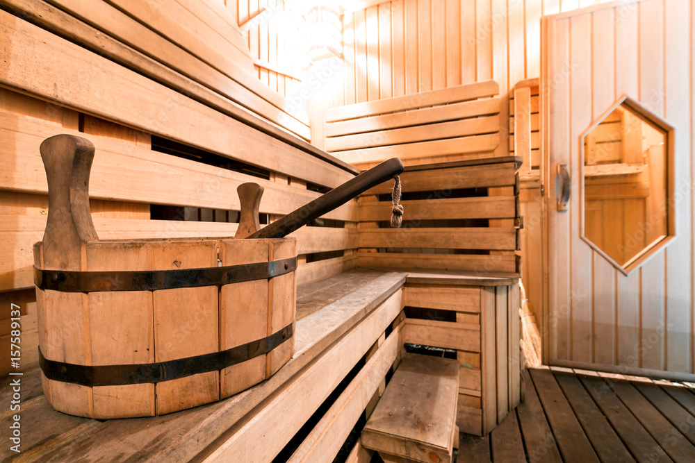 Empty wooden sauna room with ladle, bucket ready to be used Empty wooden sauna room with ladle, bucket ready to be used
