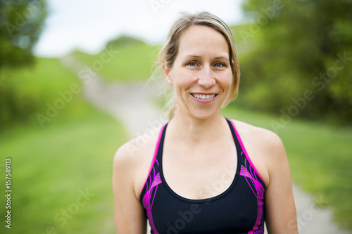 portrait of a woman jogging outdoors