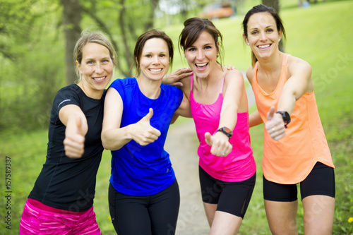 group of people enjoying in the fitness having fun running outside