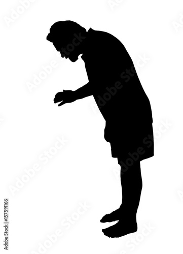 Full length side profile portrait silhouette of a man looking down