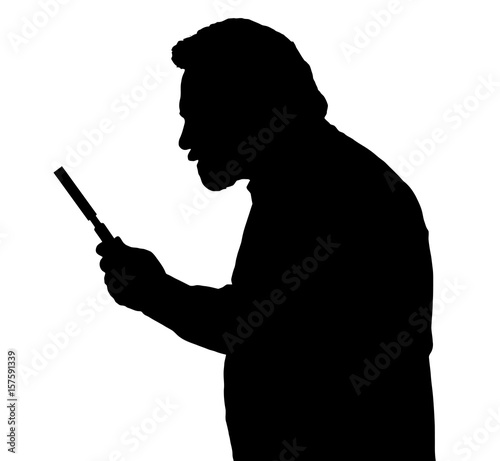 Silhouette of bearded man investigating with a magnifying glass