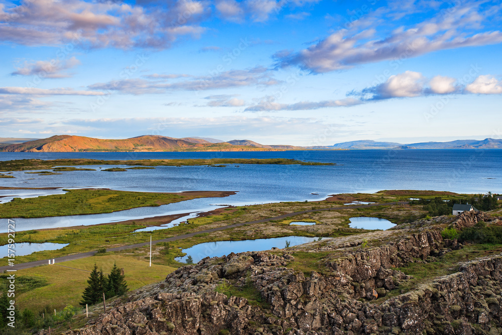 Wonderful icelandic landscape. grass land, lake, high multicolored mountains, and beautiful sky. Wonderful icelandic landscape. grass land, lake, high multicolored mountains, and beautiful sky.
