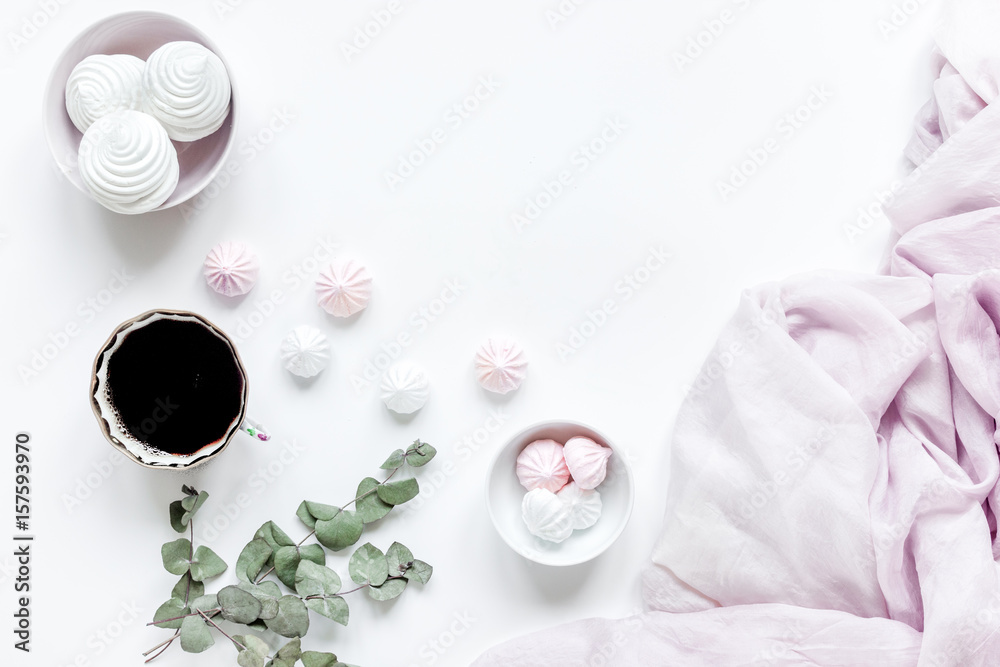 light breakfast with marsh-mallow and coffee on white table background top view space for text