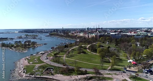 Kaivopuisto, Cinema 4k aerial view of a flight around brunnsparken, on a sunny summer day, in Helsinki, Finland photo