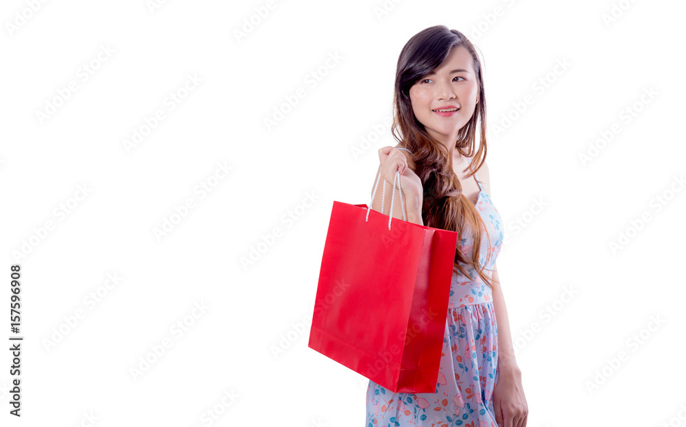 happy excited woman standing and holding colorful shopping bags isolated on a white background.