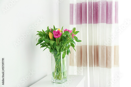 Glass vase with bouquet of ...
