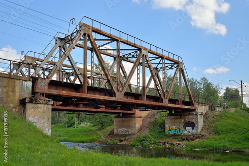 Railway bridge across the river Oredezh at Vyritsa in the summer © herculerus
