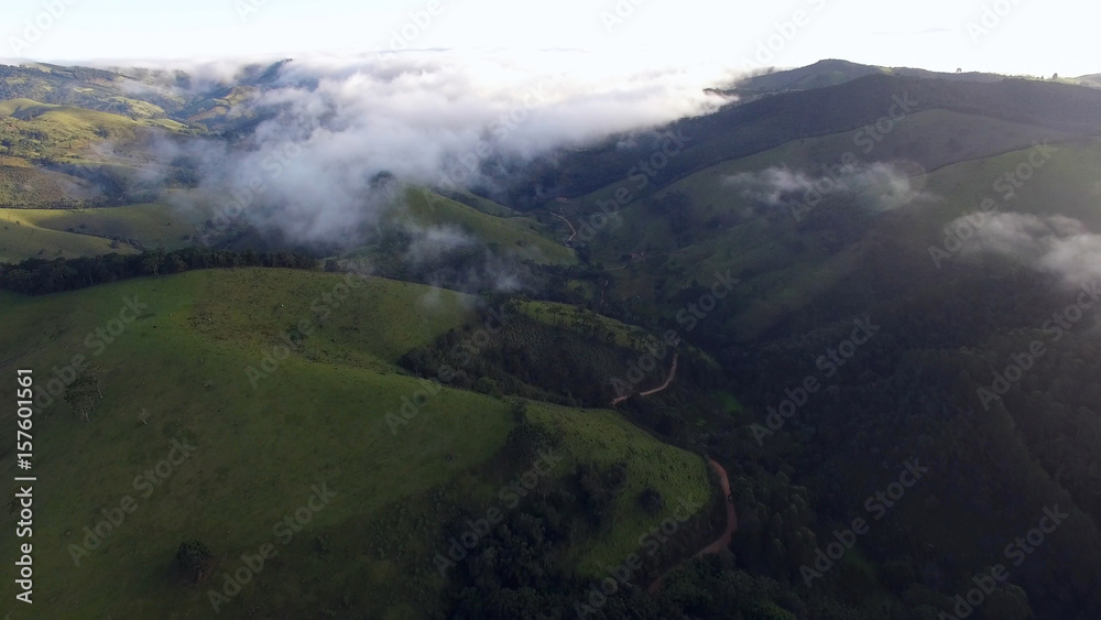 Aerial View of clouds in a Mountain Valley