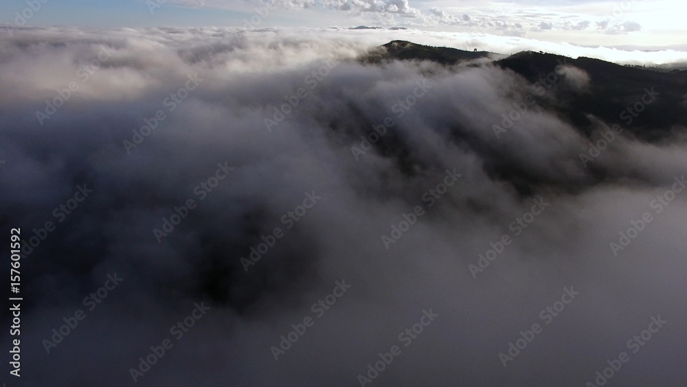 Aerial View of clouds in a Mountain Valley
