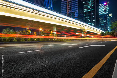 urban traffic road with cityscape at night in modern city of China.