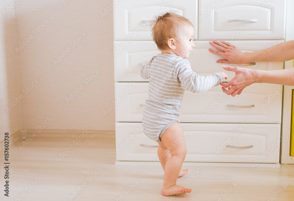 Baby child son. Mom with laughing kid. Family at home
