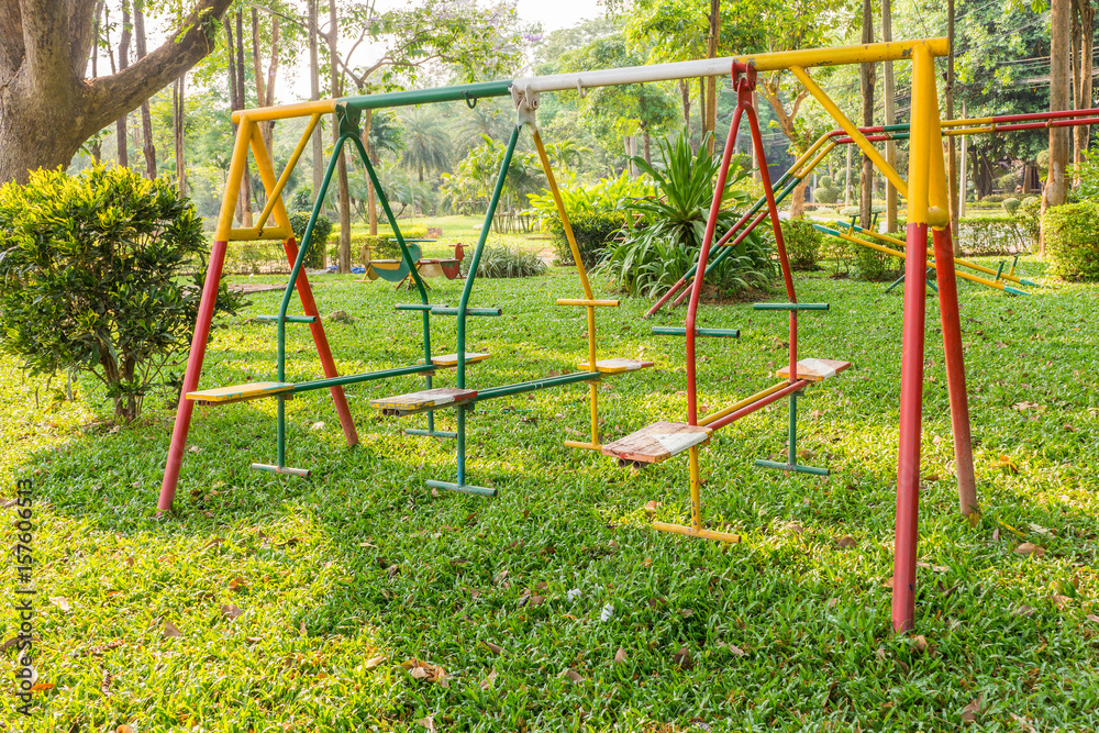 Outdoor Thai swing in playground. It is made of metal and wood. Outdoor Thai swing in playground. It is made of metal and wood.