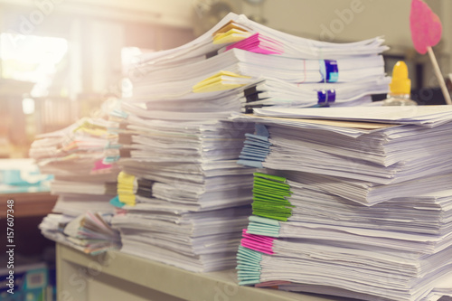 Pile of unfinished documents on office desk, Stack of business paper, Vintage Effect