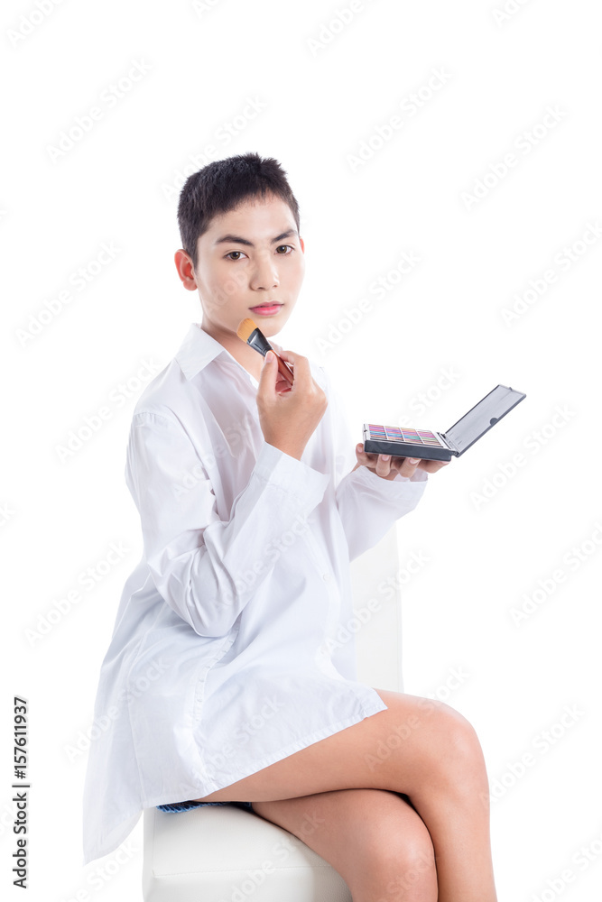 Young asian boy applying brush on over white background Young asian boy applying brush on over white background