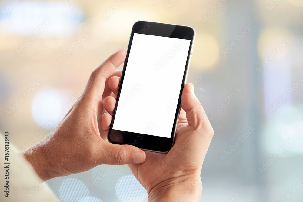 Man using smartphone on blur background. Blank screen smartphone for Graphic display montage.
