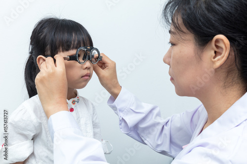 Asian Little Chinese Girl Doing Eyes Examination by ophthalmologist