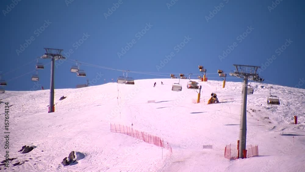 Chair lift at a ski resort on a clear and cold weather. Chair lift at a ski resort on a clear and cold weather.