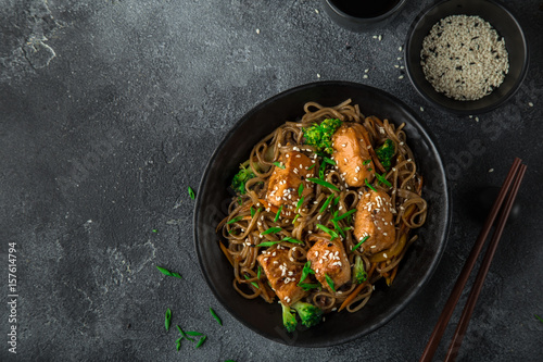 teriyaki salmon and soba noodle served with sesame seeds and chives