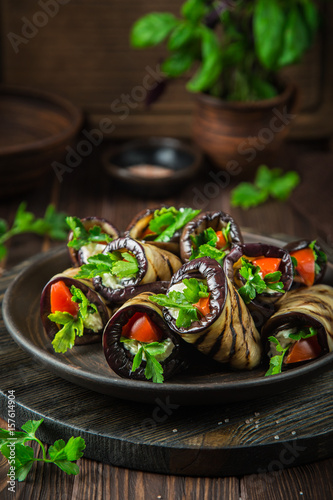 grilled eggplant rolls with garlic feta, tomato and herbs