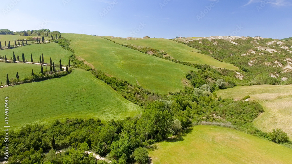 Fototapeta premium Tuscany countryside hills, stunning aerial view in spring