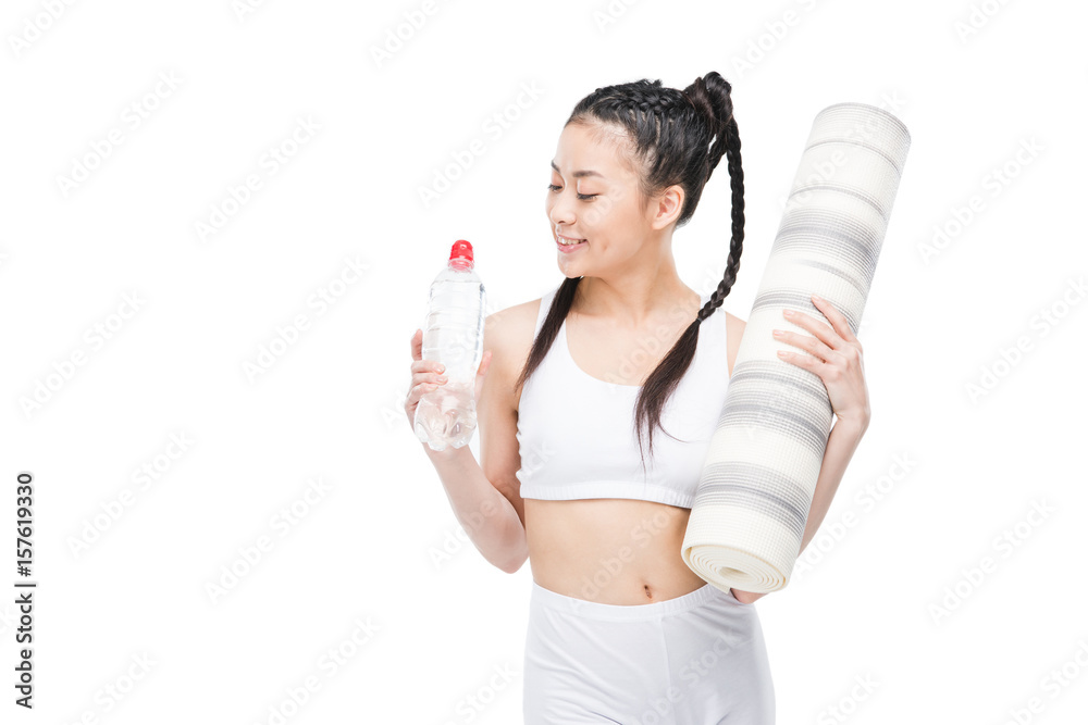 asian girl in white sportswear holding yoga mat and bottle of water isolated on white asian girl in white sportswear holding yoga mat and bottle of water isolated on white