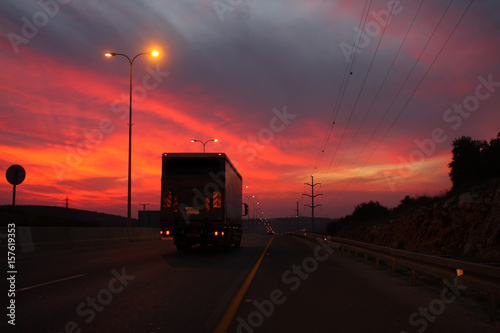 Truck on sunset background
