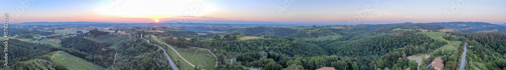 Amazing sunset panoramic aerial view of Tuscany hills in spring season - Italy